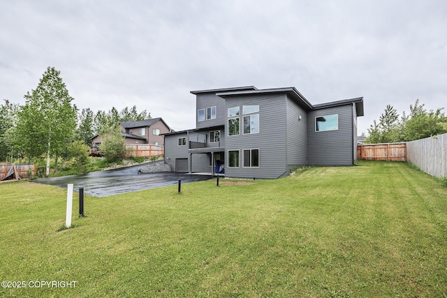 9475 E Spring Creek Cir, Wasilla, AK 99654 - rear view of property with an attached garage and asphalt driveway