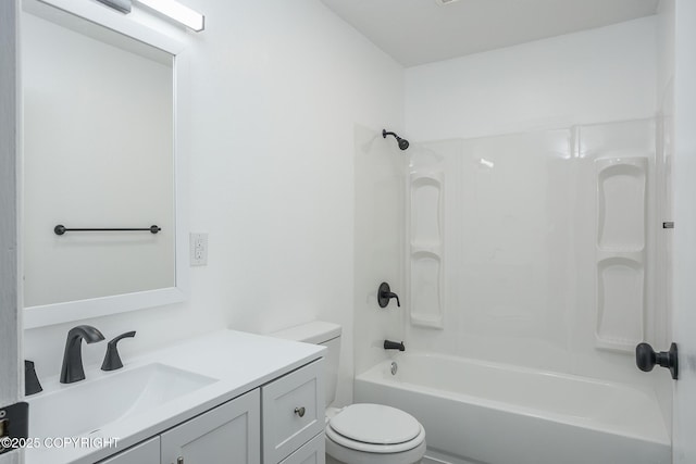 bathroom with vanity,  shower combination, and toilet