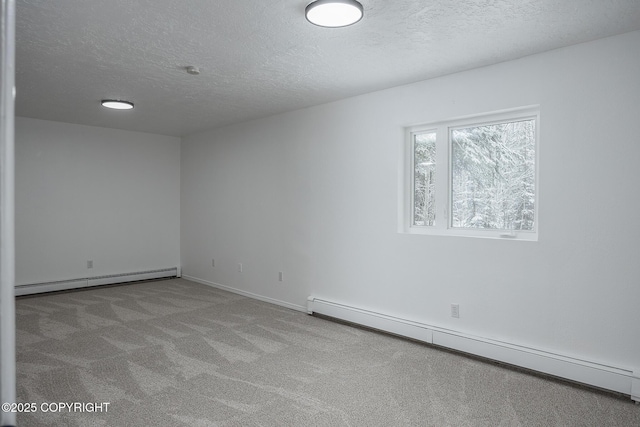 empty room featuring a baseboard radiator, carpet floors, a textured ceiling, and a baseboard heating unit