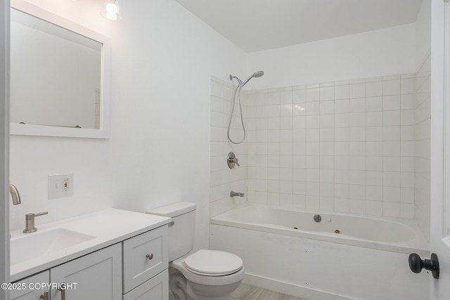 full bath featuring toilet, vanity, and shower / tub combination