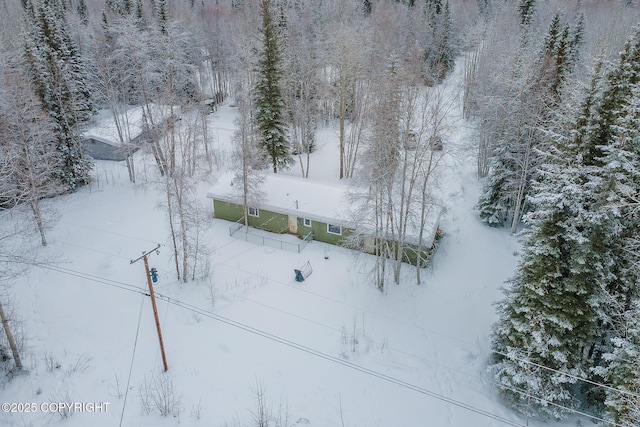 snowy aerial view with a view of trees