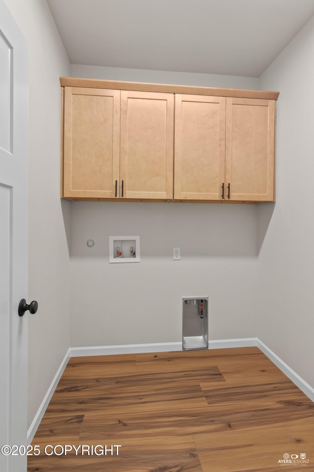 washroom with hookup for a washing machine, wood finished floors, baseboards, hookup for an electric dryer, and hookup for a gas dryer