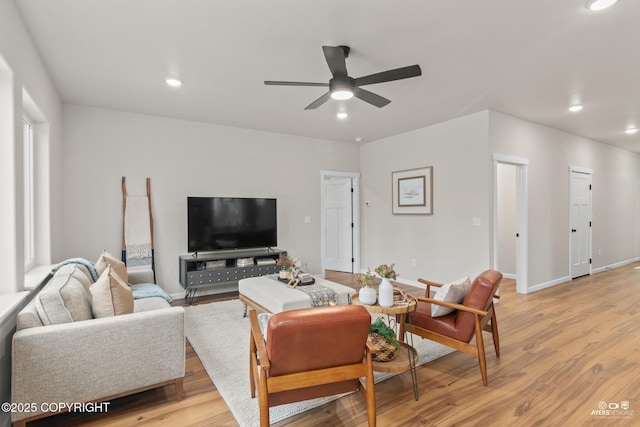 living area featuring recessed lighting, baseboards, light wood-style floors, and ceiling fan