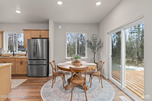 dining room featuring visible vents, recessed lighting, light wood-style floors, and baseboards