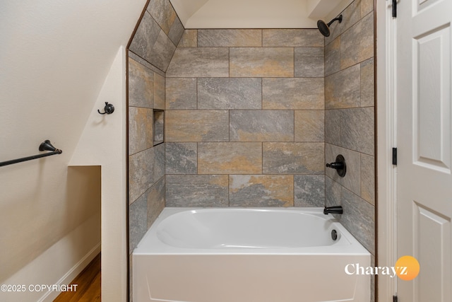 bathroom with baseboards and bathing tub / shower combination