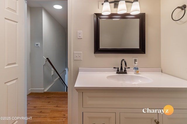 bathroom featuring wood finished floors and vanity