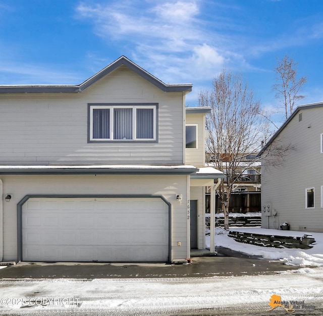 traditional-style house featuring an attached garage