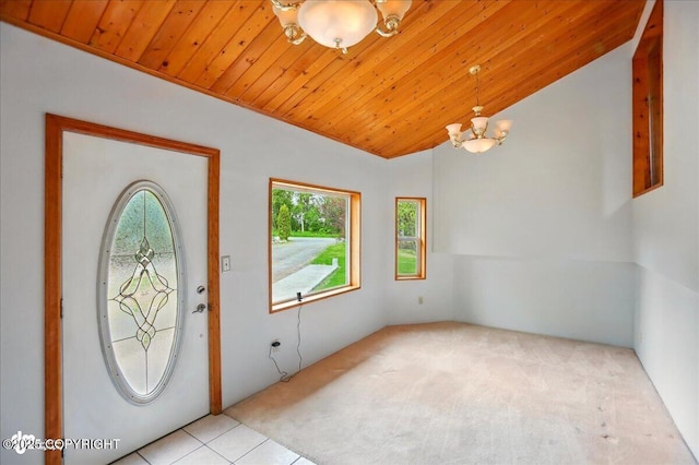 24508 Reese Rd, Chugiak, AK 99567 - entryway featuring a chandelier, wooden ceiling, carpet floors, and vaulted ceiling