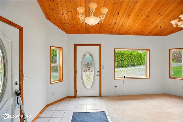 24508 Reese Rd, Chugiak, AK 99567 - entrance foyer featuring a chandelier, wood ceiling, and light tile patterned floors