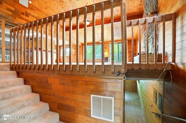 24508 Reese Rd, Chugiak, AK 99567 - staircase with wooden walls and wooden ceiling