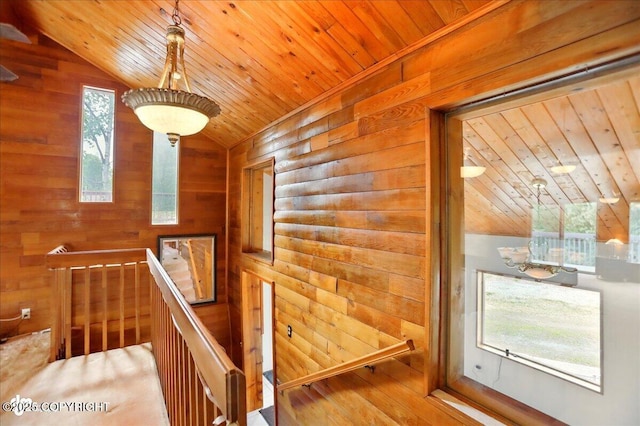 24508 Reese Rd, Chugiak, AK 99567 - stairs with wood ceiling, vaulted ceiling, wooden walls, and wood finished floors