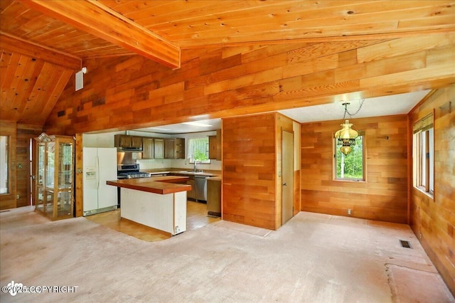 24508 Reese Rd, Chugiak, AK 99567 - kitchen featuring appliances with stainless steel finishes, wooden walls, butcher block counters, wooden ceiling, and a sink