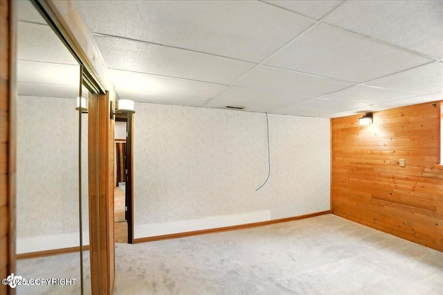 24508 Reese Rd, Chugiak, AK 99567 - finished basement with wood walls, carpet flooring, and a drop ceiling