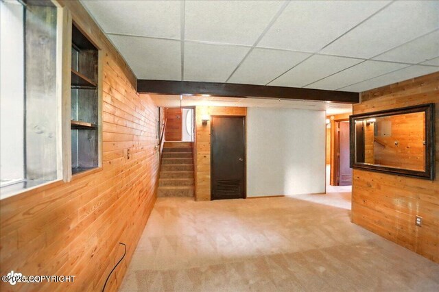24508 Reese Rd, Chugiak, AK 99567 - empty room with wood walls, stairs, and carpet floors