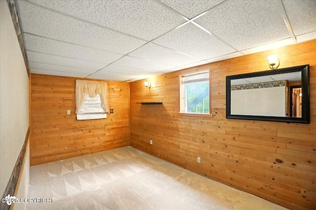 24508 Reese Rd, Chugiak, AK 99567 - below grade area featuring wooden walls, carpet floors, and a drop ceiling