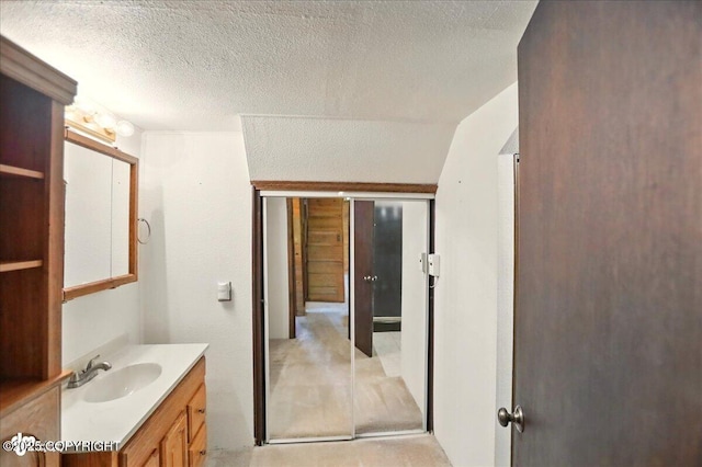 24508 Reese Rd, Chugiak, AK 99567 - bathroom featuring vanity and a textured ceiling