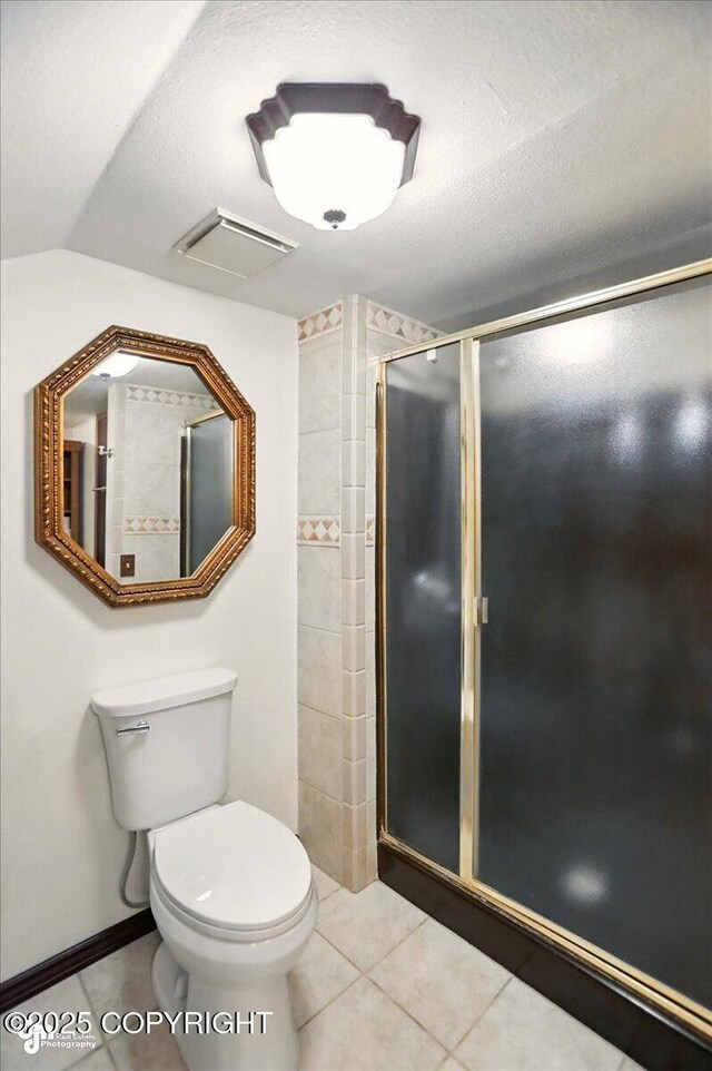 24508 Reese Rd, Chugiak, AK 99567 - full bathroom with toilet, tile patterned flooring, and a shower stall