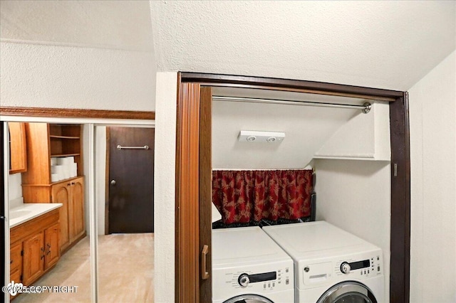 24508 Reese Rd, Chugiak, AK 99567 - laundry room featuring washing machine and dryer and light tile patterned floors