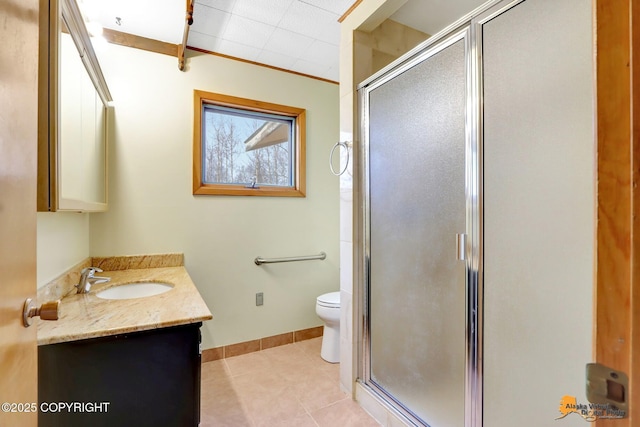 full bathroom with vanity, toilet, baseboards, and a stall shower