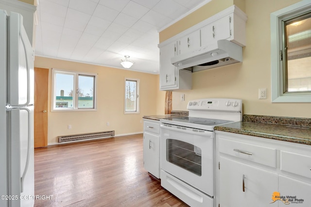 kitchen with white appliances, wood finished floors, under cabinet range hood, white cabinetry, and baseboard heating