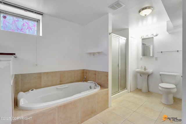 bathroom featuring tile patterned floors, visible vents, toilet, a stall shower, and a bath