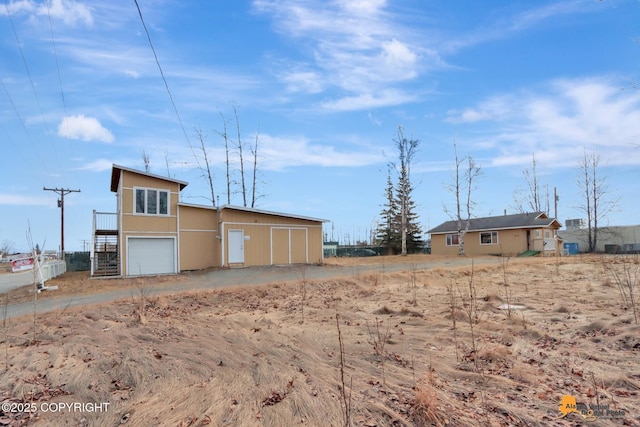 view of outbuilding with an attached garage