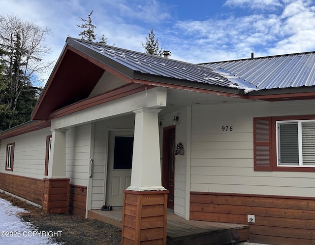 exterior space featuring metal roof