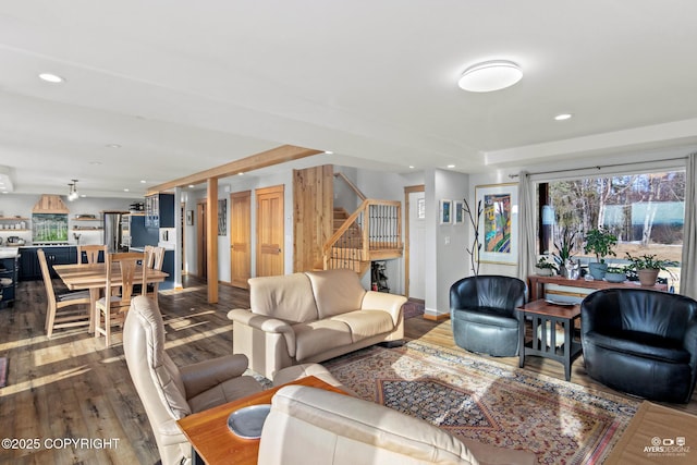 living area with recessed lighting, stairway, baseboards, and dark wood-style floors