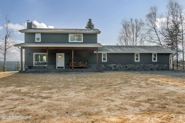 view of front of property with covered porch and a chimney