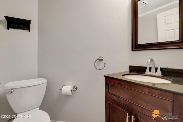 bathroom with vanity and toilet