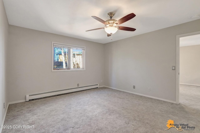 carpeted spare room featuring ceiling fan, baseboards, and a baseboard radiator