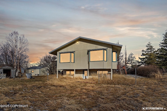 view of back of house at dusk