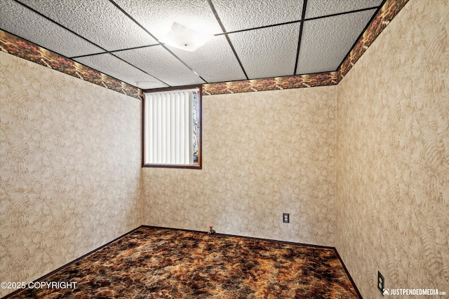 spare room featuring a paneled ceiling