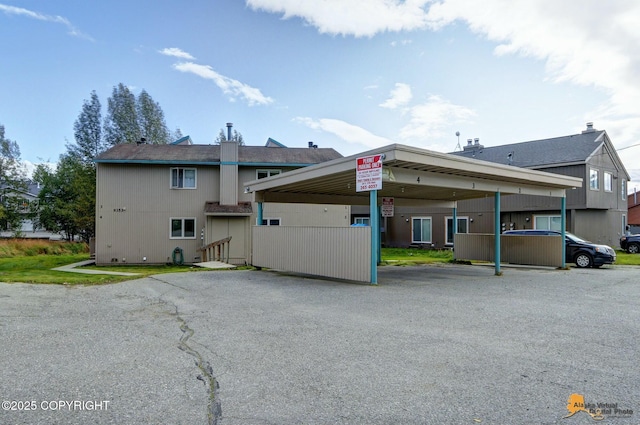 exterior space with covered parking