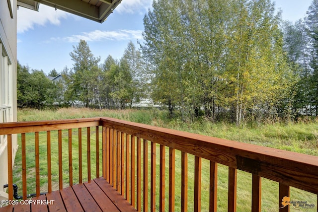 deck featuring a lawn