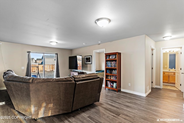 living room with dark wood finished floors and baseboards