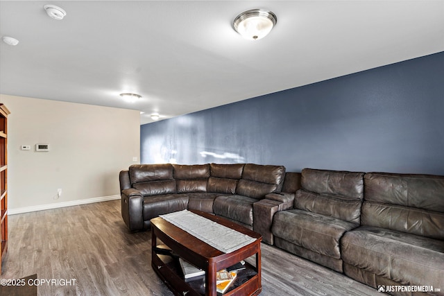 living room with baseboards and wood finished floors