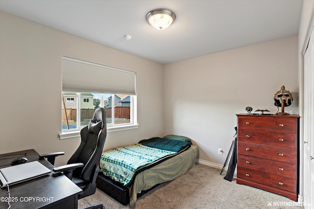 carpeted bedroom with baseboards