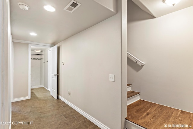 corridor with stairway, wood finished floors, baseboards, visible vents, and recessed lighting