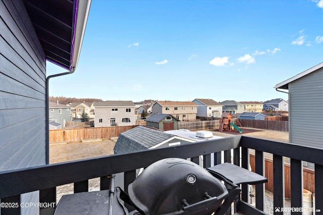 balcony with grilling area and a residential view