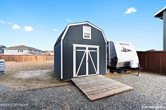 view of shed with a fenced backyard