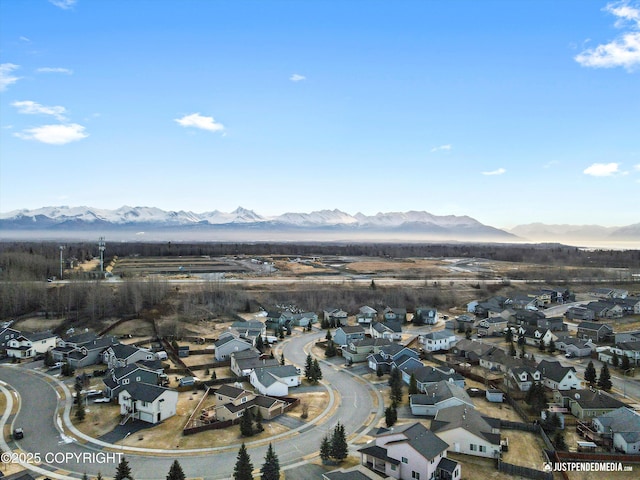 drone / aerial view with a residential view and a mountain view