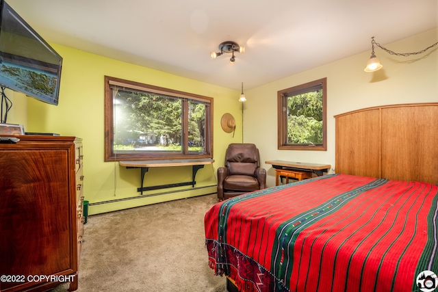 bedroom featuring a baseboard radiator and carpet