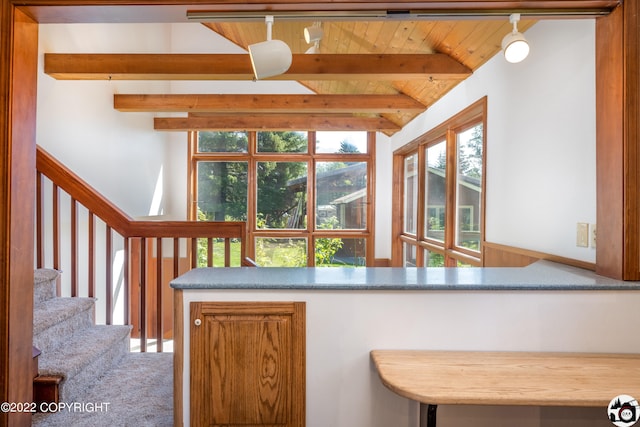 kitchen with lofted ceiling with beams and wooden ceiling