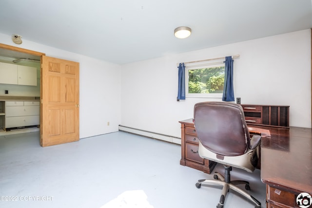 office area with baseboard heating and concrete floors