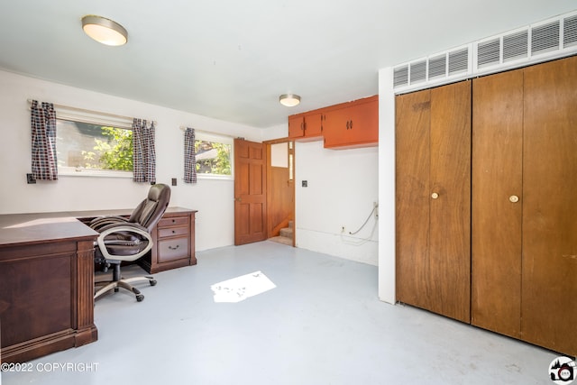 home office with finished concrete flooring