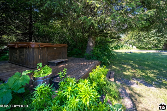 wooden terrace with a hot tub