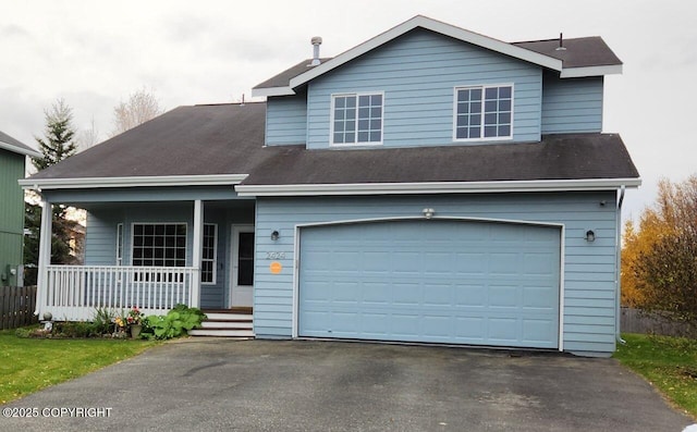 view of front of home with aphalt driveway and covered porch