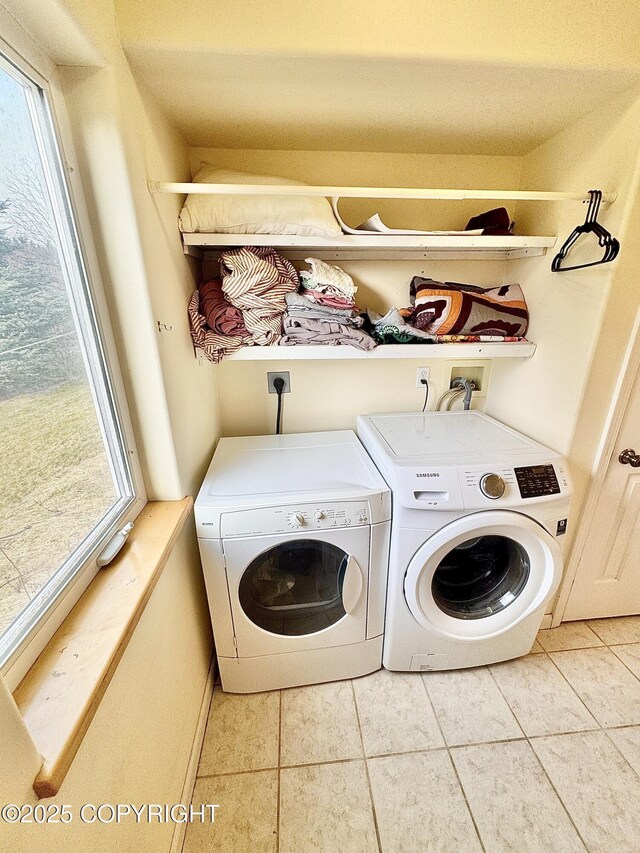4735 Tamara St, Homer, AK 99603 - laundry room featuring tile patterned flooring, laundry area, and washing machine and clothes dryer