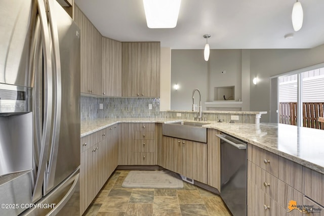 1091 Northpointe Bluff Dr, Anchorage, AK 99501 - kitchen with stainless steel appliances, decorative backsplash, light stone counters, stone finish flooring, and light brown cabinetry